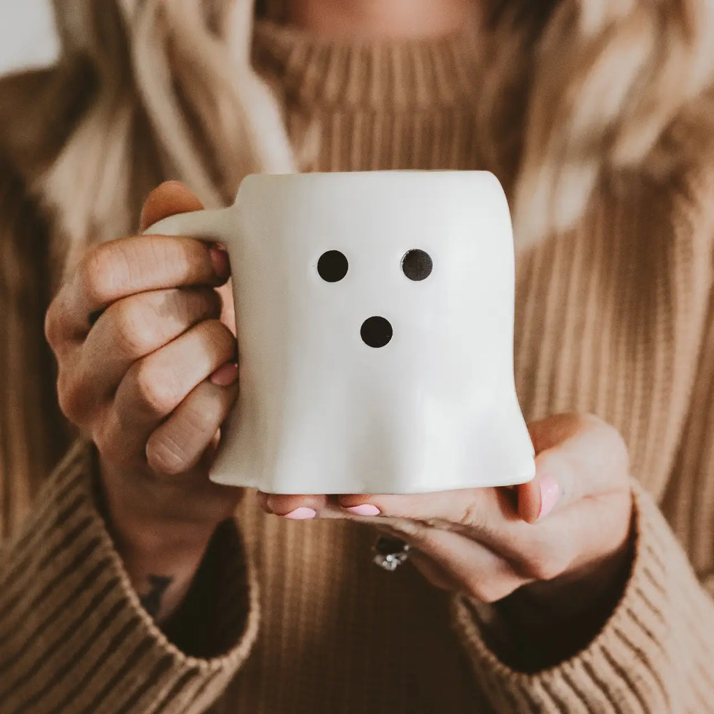 Cream ceramic mug with ghost face design