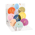 Pop-up birthday card with colorful balloon design spelling HOORAY
